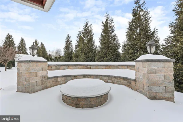 a view of a terrace with a bench and trees
