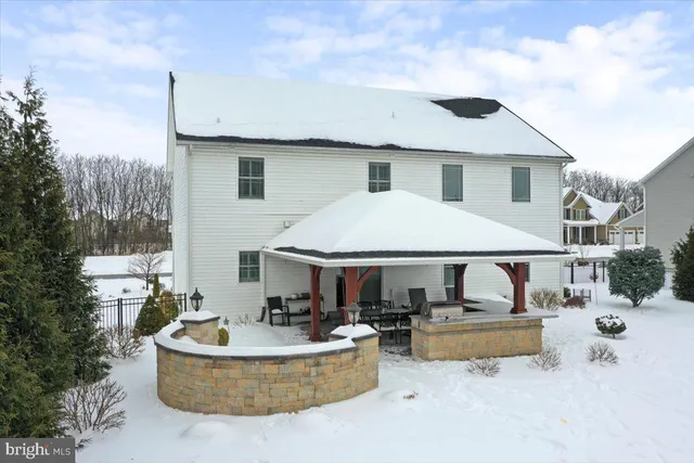 a bathroom with a bathtub and mirror