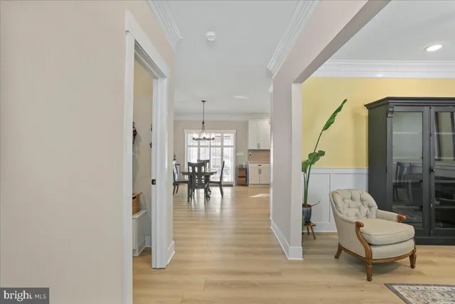 a view of dining room with wooden floor and furniture