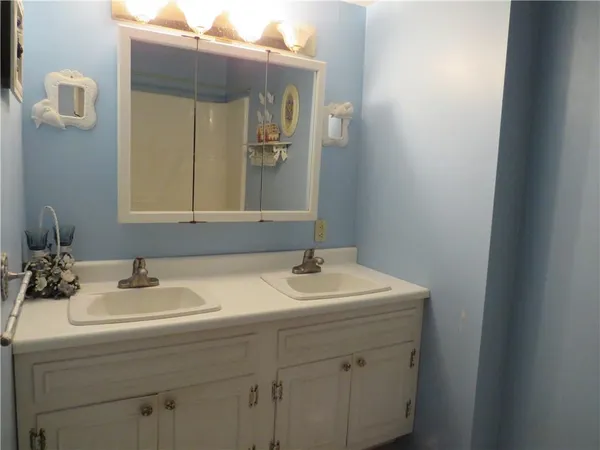 a bathroom with a sink and a mirror