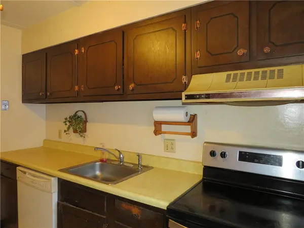 a kitchen with a sink and cabinets