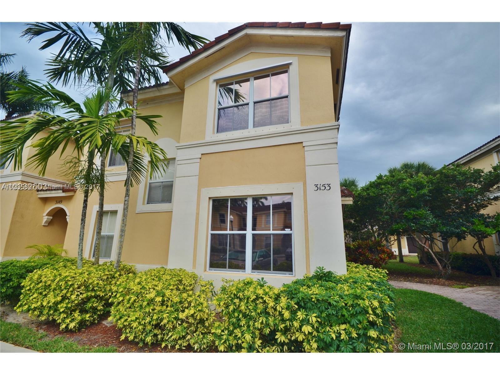 3153 Southwest 129th Terrace, Unit 161 Miramar, FL 33027 - Photo 1 of 17 a front view of house with yard and green space