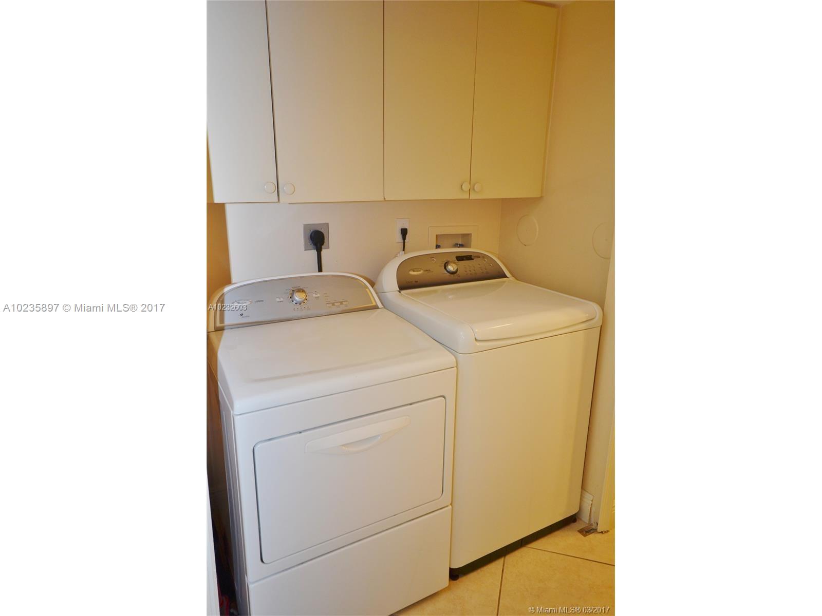 3153 Southwest 129th Terrace, Unit 161 Miramar, FL 33027 - Photo 14 of 17 a utility room with dryer and washer
