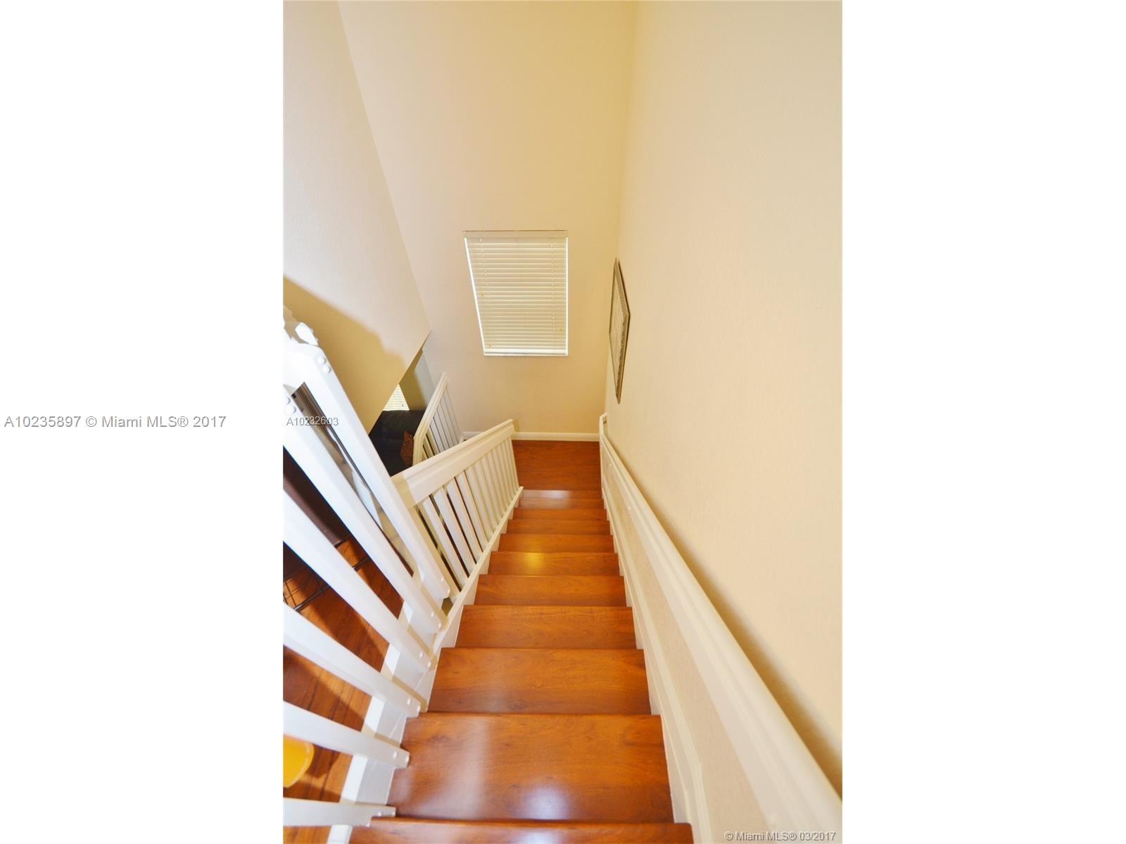 3153 Southwest 129th Terrace, Unit 161 Miramar, FL 33027 - Photo 17 of 17 a view of a hallway with staircase