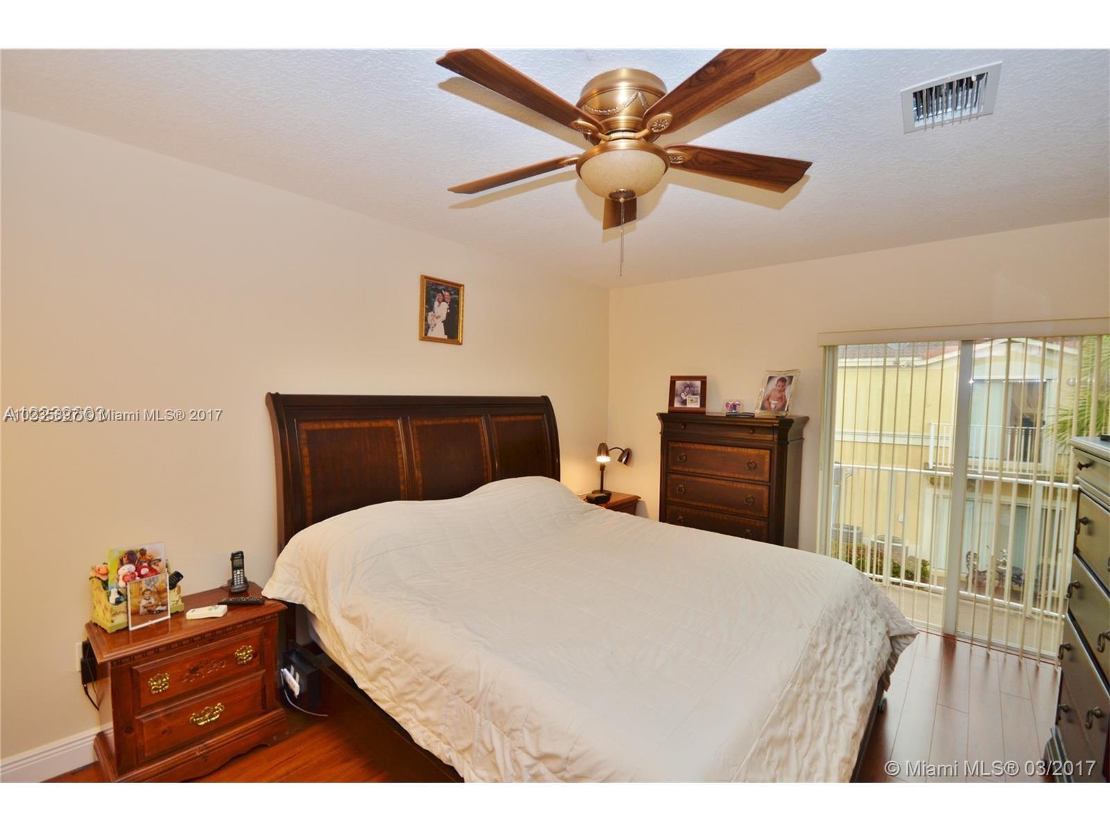 3153 Southwest 129th Terrace, Unit 161 Miramar, FL 33027 - Photo 6 of 17 a bedroom with a bed and a dresser