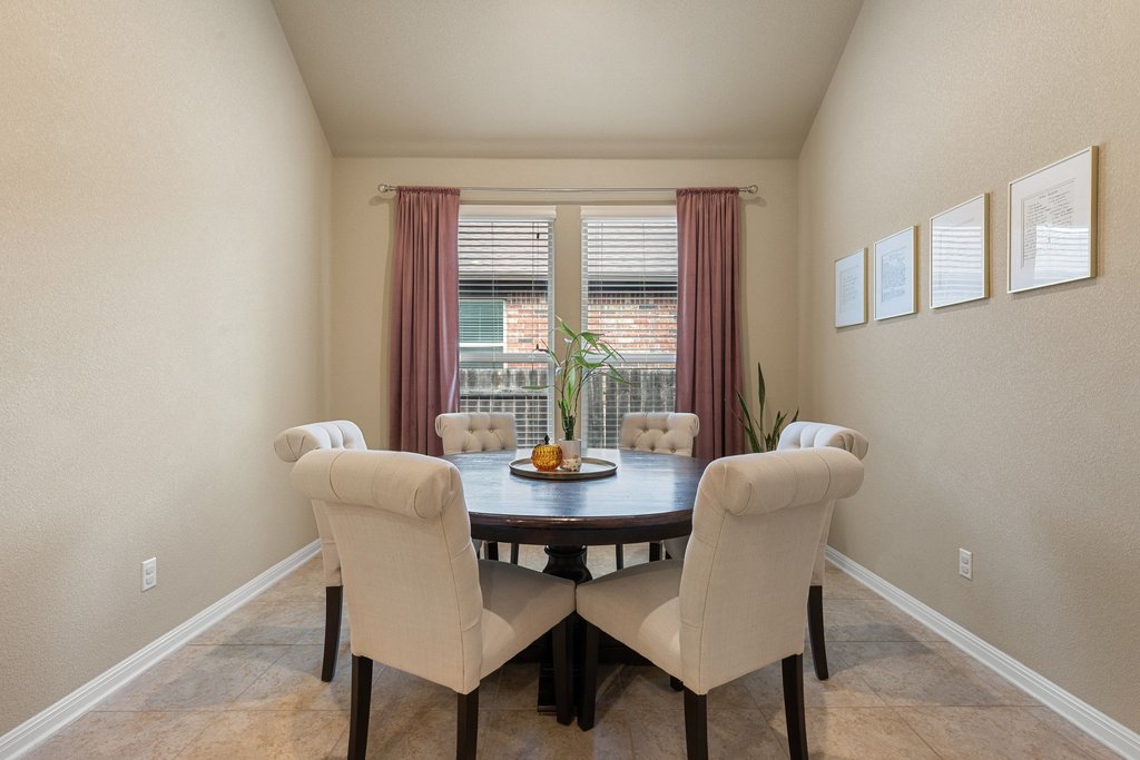 13808 Field Stream Lane Manor, TX 78653 - Photo 15 of 39 Dining area featuring a textured wall and lofted ceiling