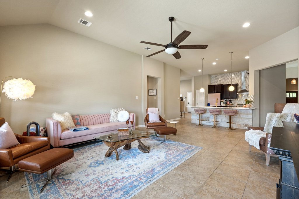 13808 Field Stream Lane Manor, TX 78653 - Photo 18 of 39 Living area with a ceiling fan, vaulted ceiling, recessed lighting, and light tile patterned flooring