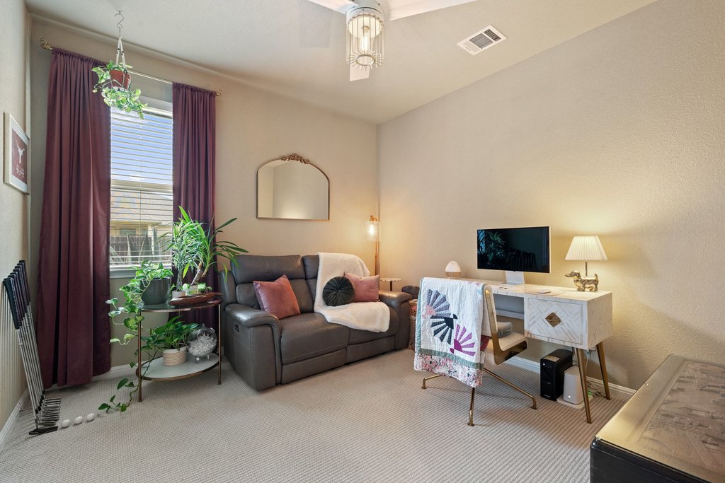 13808 Field Stream Lane Manor, TX 78653 - Photo 30 of 39 Living room with baseboards and light carpet