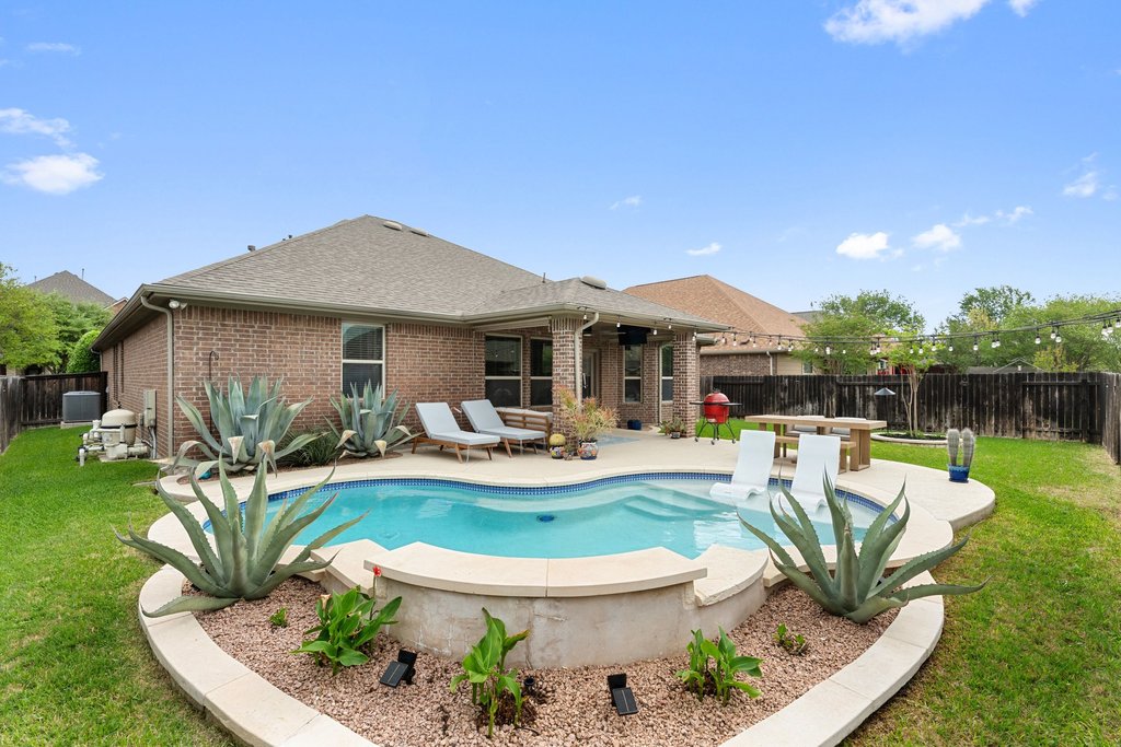 13808 Field Stream Lane Manor, TX 78653 - Photo 6 of 39 View of pool featuring a fenced backyard and patio surround