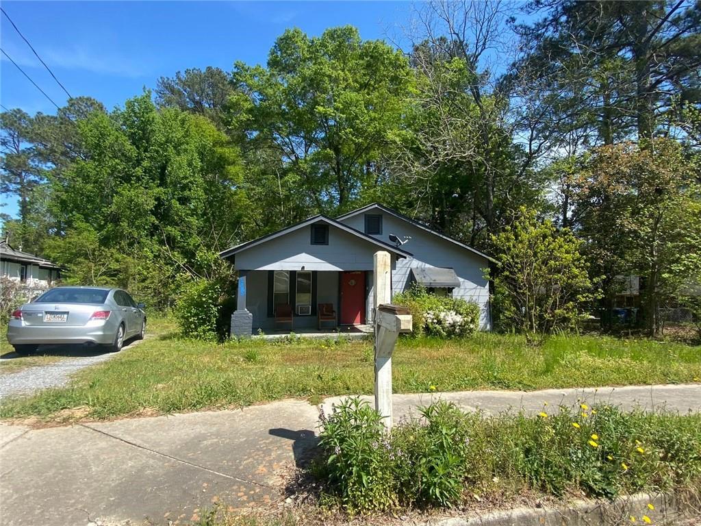 2429 New Clinton Road Macon, GA 31217 - Photo 1 of 1 a front view of a house with garden