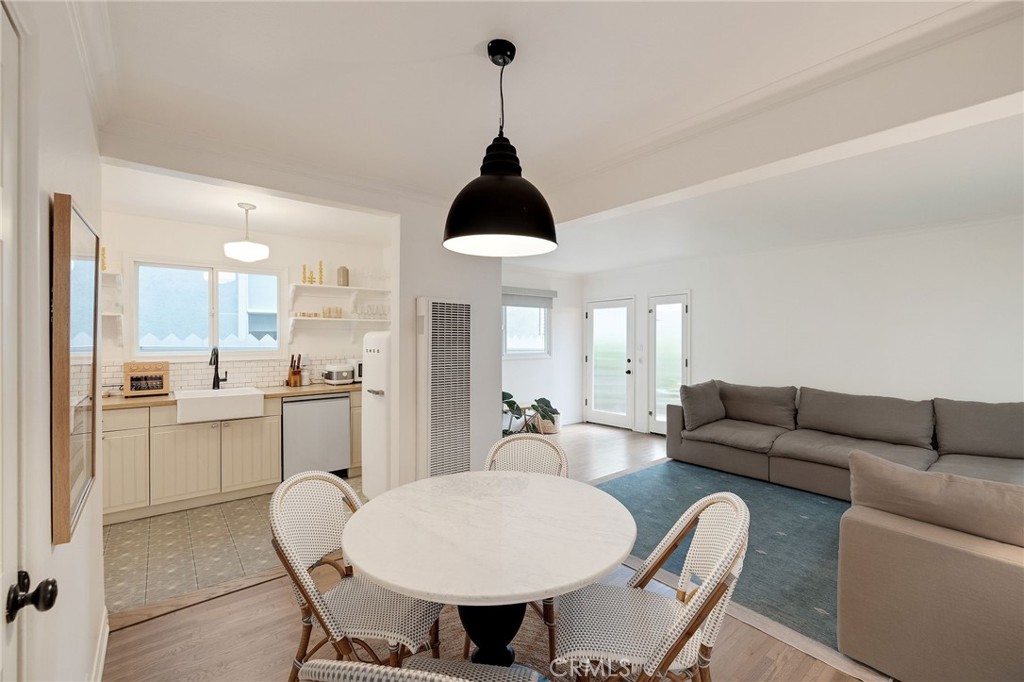 1706 Carver Street Redondo Beach, CA 90278 - Photo 11 of 40 a living room with furniture a dining table and a chandelier