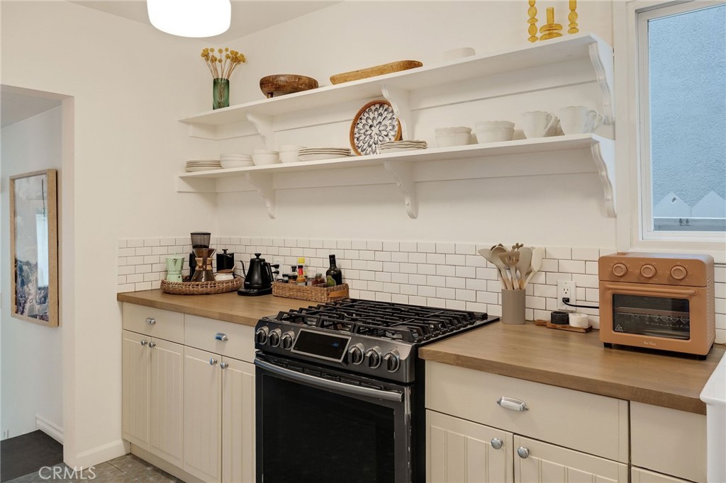 1706 Carver Street Redondo Beach, CA 90278 - Photo 14 of 40 a kitchen with a stove and cabinets