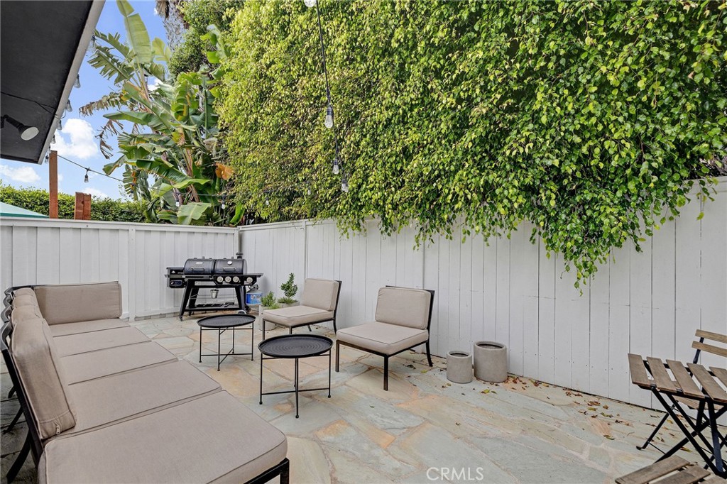 1706 Carver Street Redondo Beach, CA 90278 - Photo 24 of 40 a backyard of a house with table and chairs