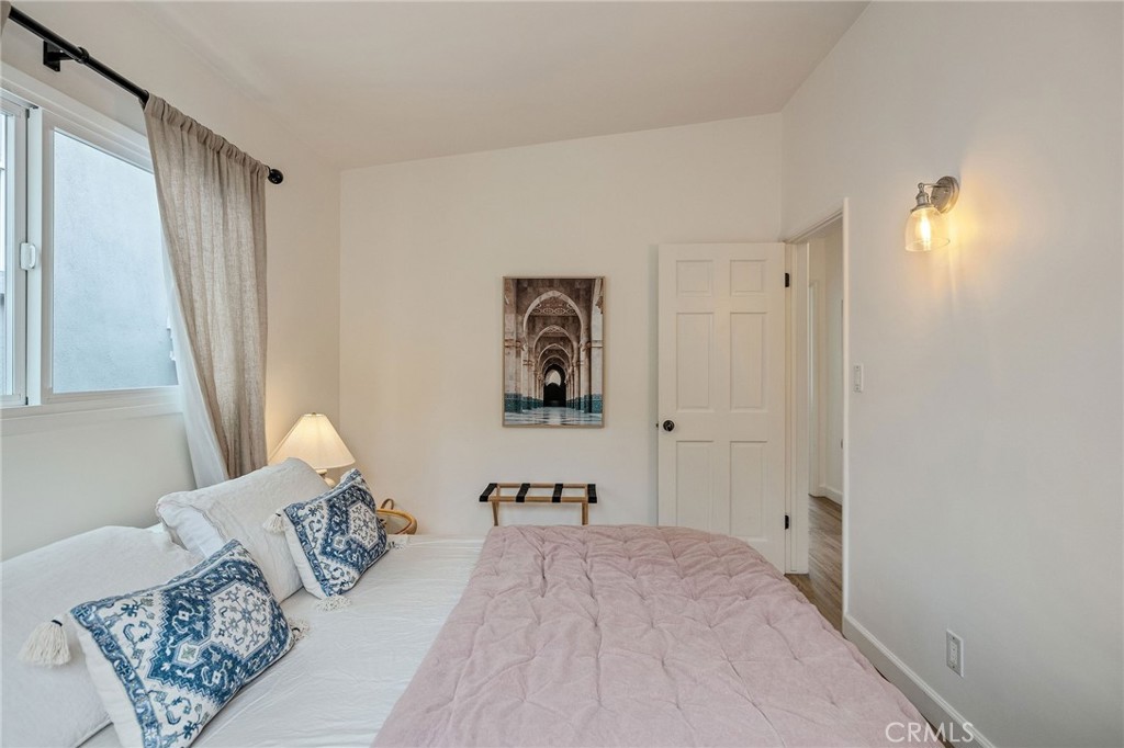 1706 Carver Street Redondo Beach, CA 90278 - Photo 34 of 40 a bedroom with a large bed and a window