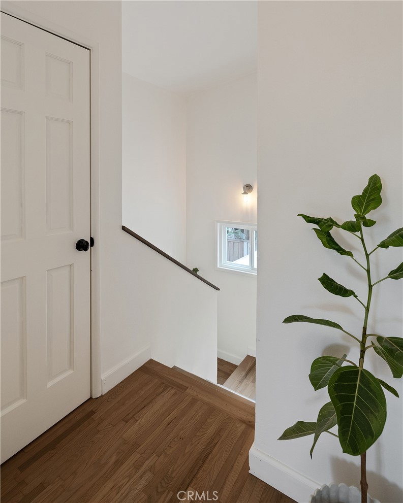 1706 Carver Street Redondo Beach, CA 90278 - Photo 38 of 40 a bedroom with a bed and a potted plant