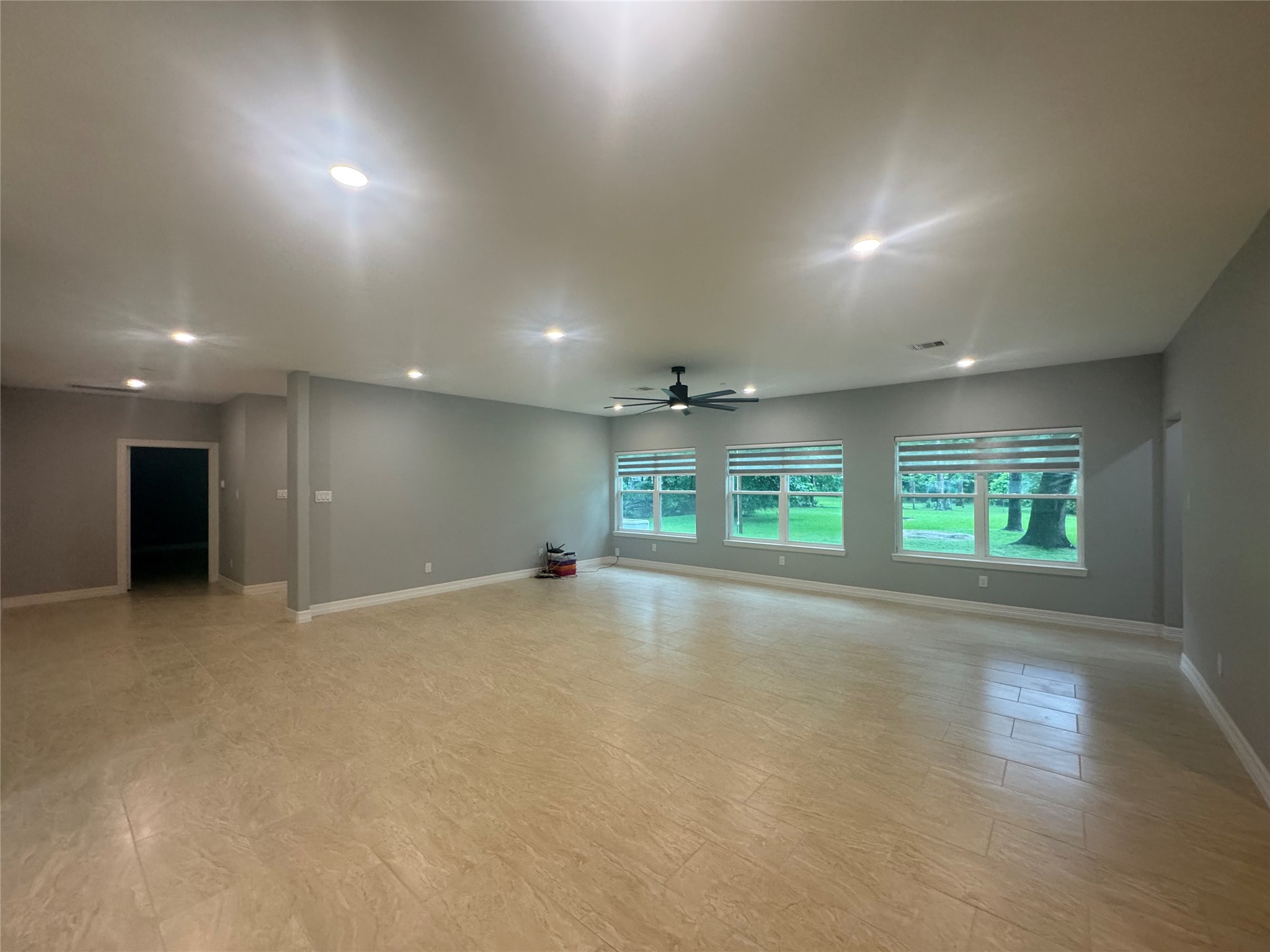 2010 Cherry Laurel Spring, TX 77386 - Photo 19 of 45 Reverse view of living room, primary bedroom and hallway to the left