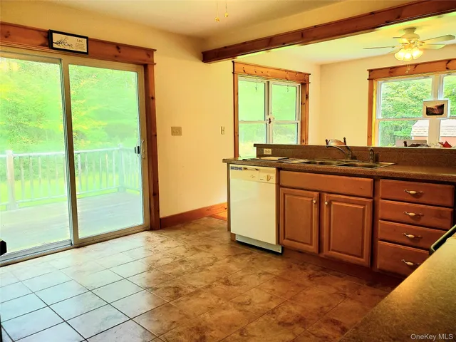 a view of a kitchen with a sink and cabinets