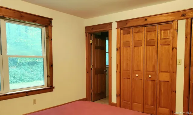 a bathroom with a sink vanity mirror and toilet