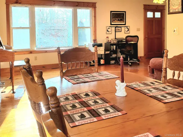 a living room with furniture and next to a window