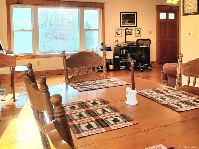 a living room with furniture and next to a window