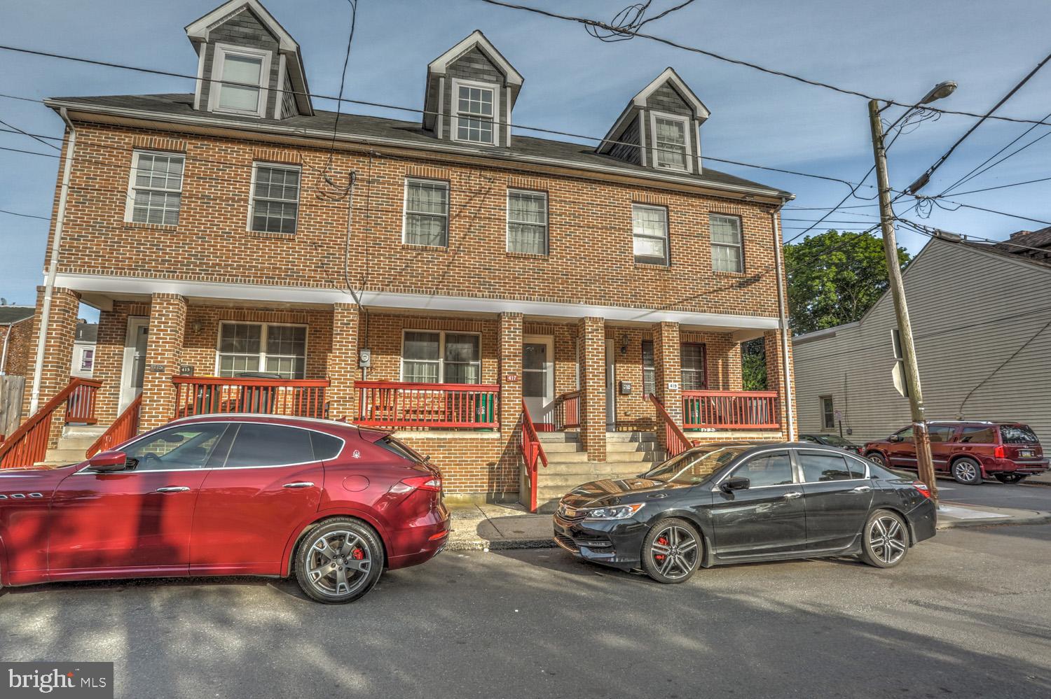 417 Green Street Lancaster, PA 17602 - Photo 2 of 37 a car parked in front of a house