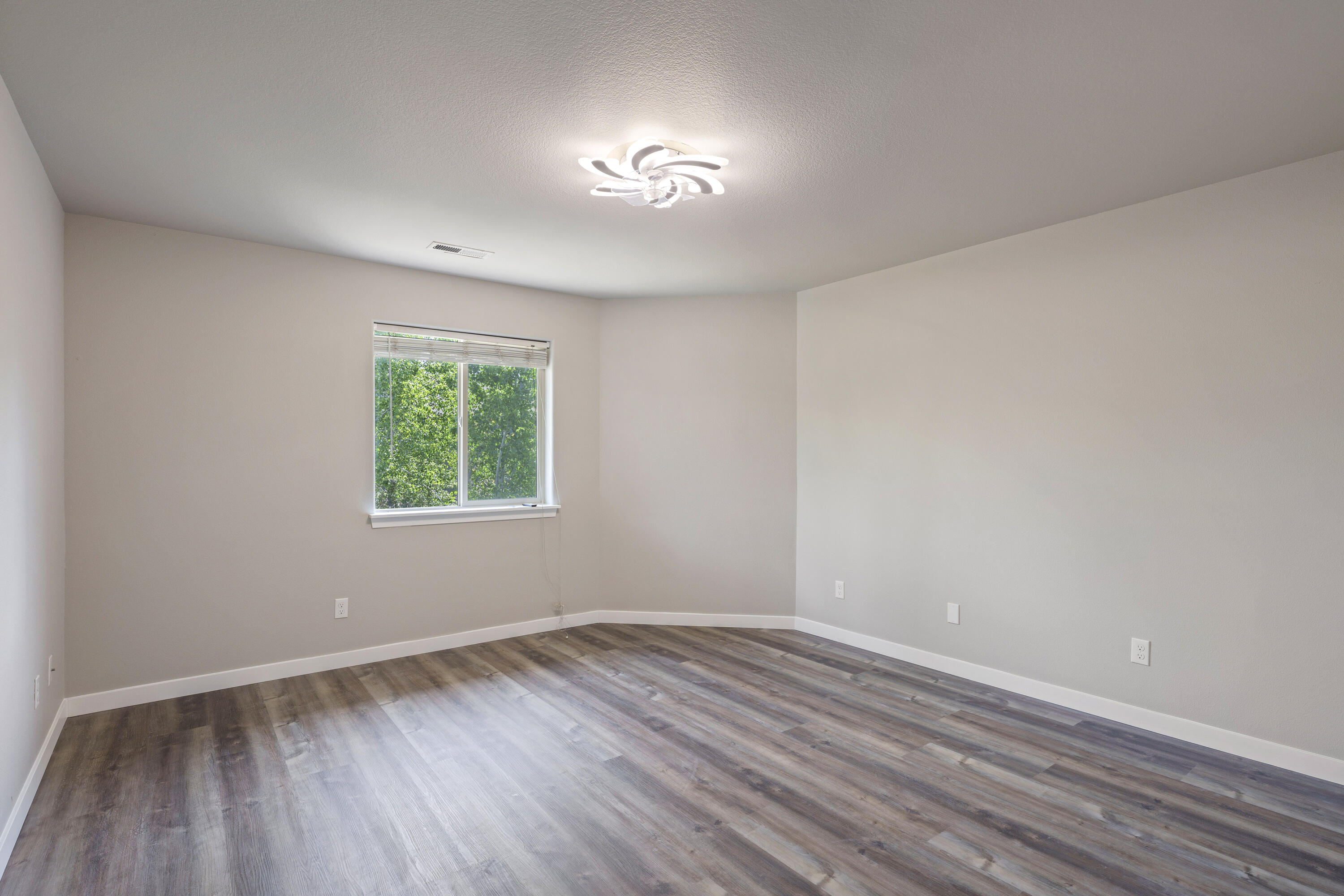 21189 Ritz Place Bend, OR 97702 - Photo 29 of 37 wooden floor in an empty room with a window