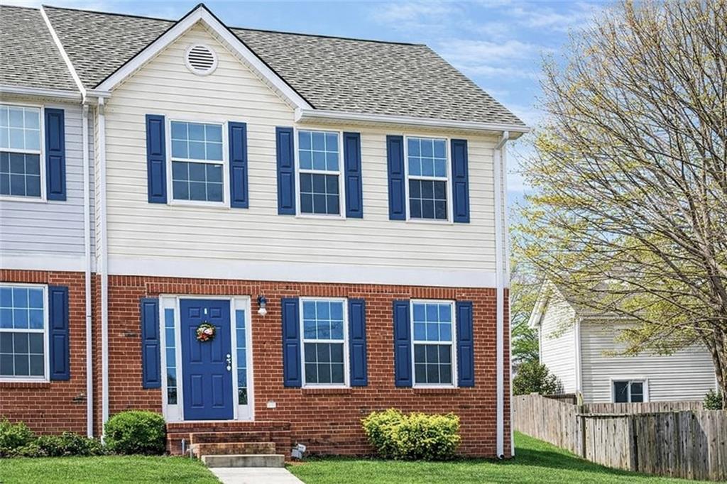111 Westside Chase Southwest Cartersville, GA 30120 - Photo 1 of 1 a front view of a house with garden