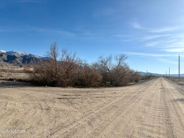a view of hard area with mountain in the background