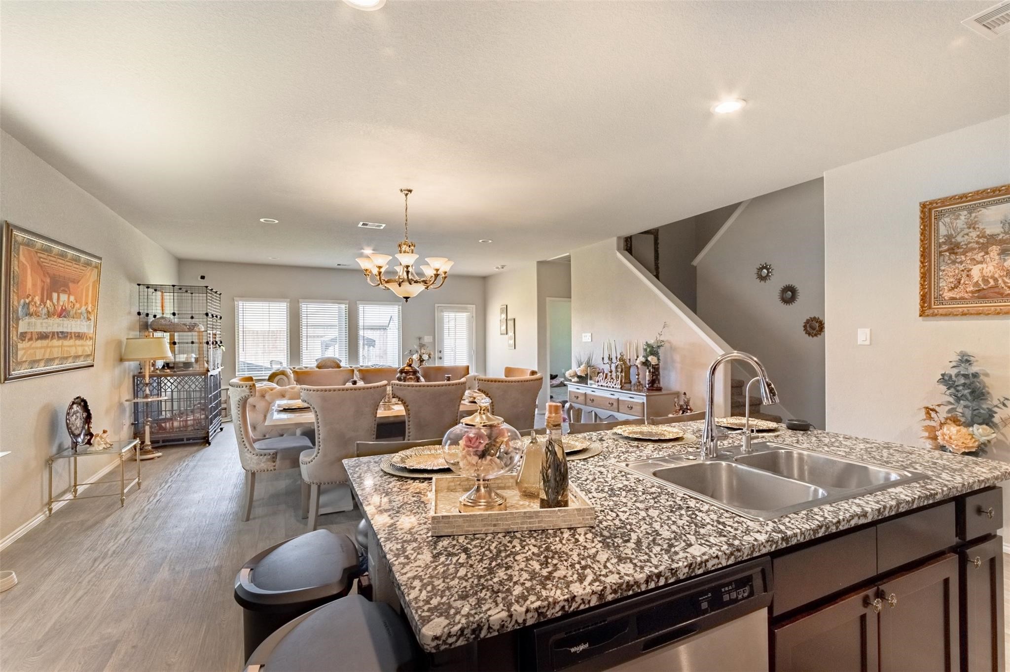 Bright and spacious living area with an open layout, abundant natural light, and seamless flow into the dining and kitchen spaces. Perfect for everyday living and entertaining.