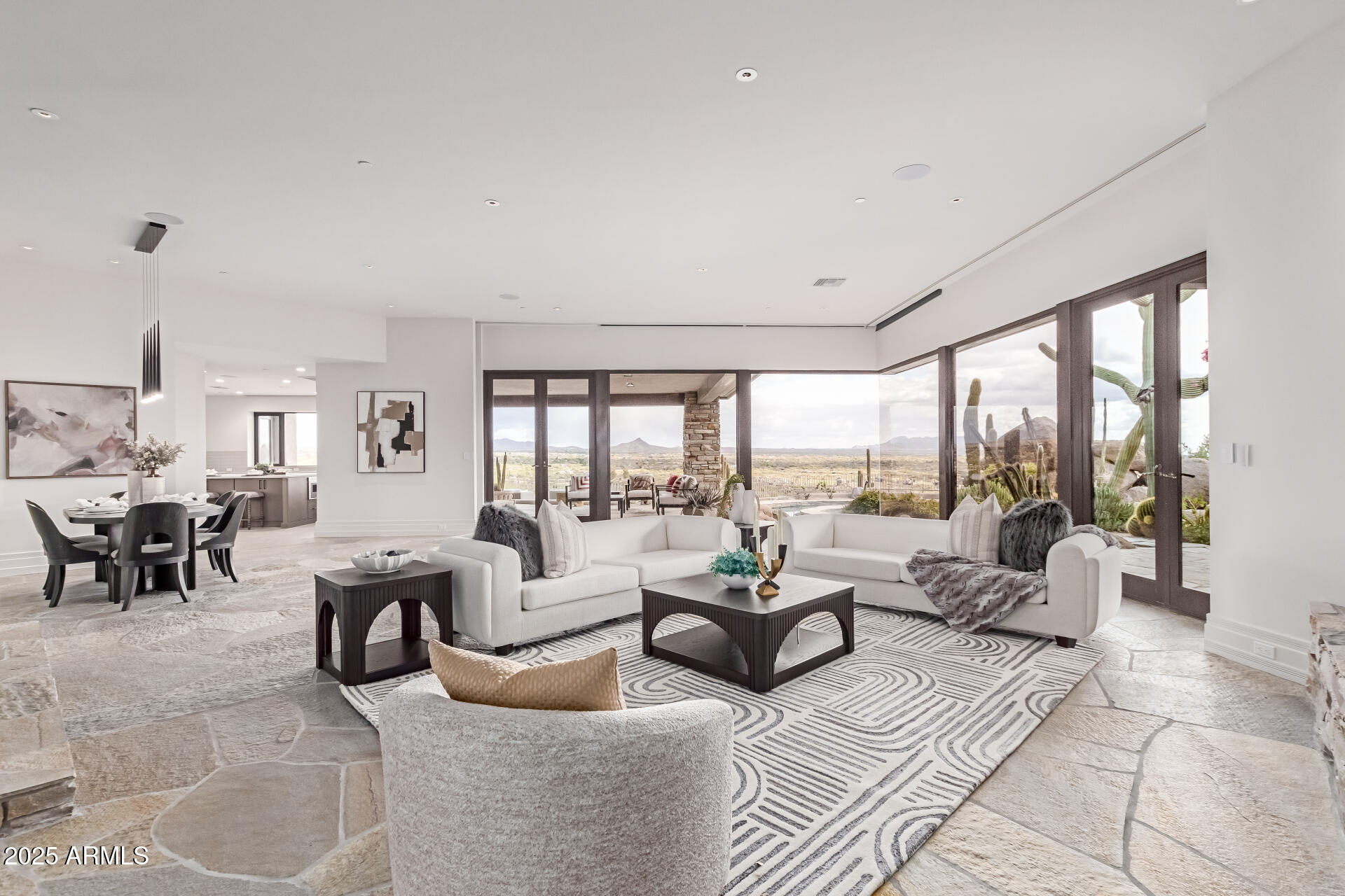 6901 East Restin Road Carefree, AZ 85377 - Photo 11 of 59 a living room with furniture and large windows