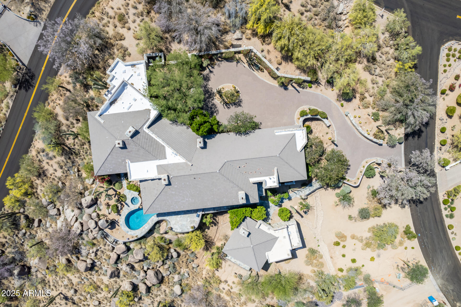 6901 East Restin Road Carefree, AZ 85377 - Photo 2 of 59 an aerial view of a house with a yard and sitting space