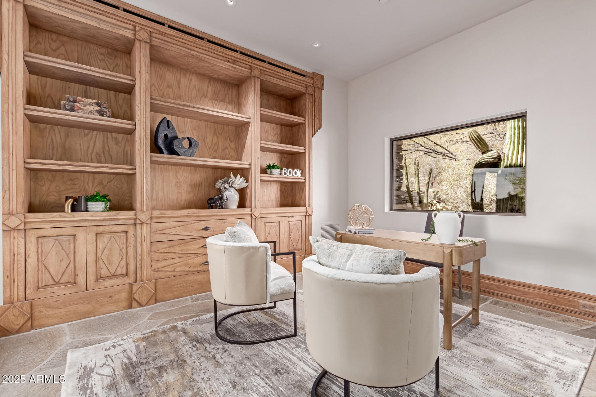 6901 East Restin Road Carefree, AZ 85377 - Photo 21 of 59 a living room with furniture a rug and white walls