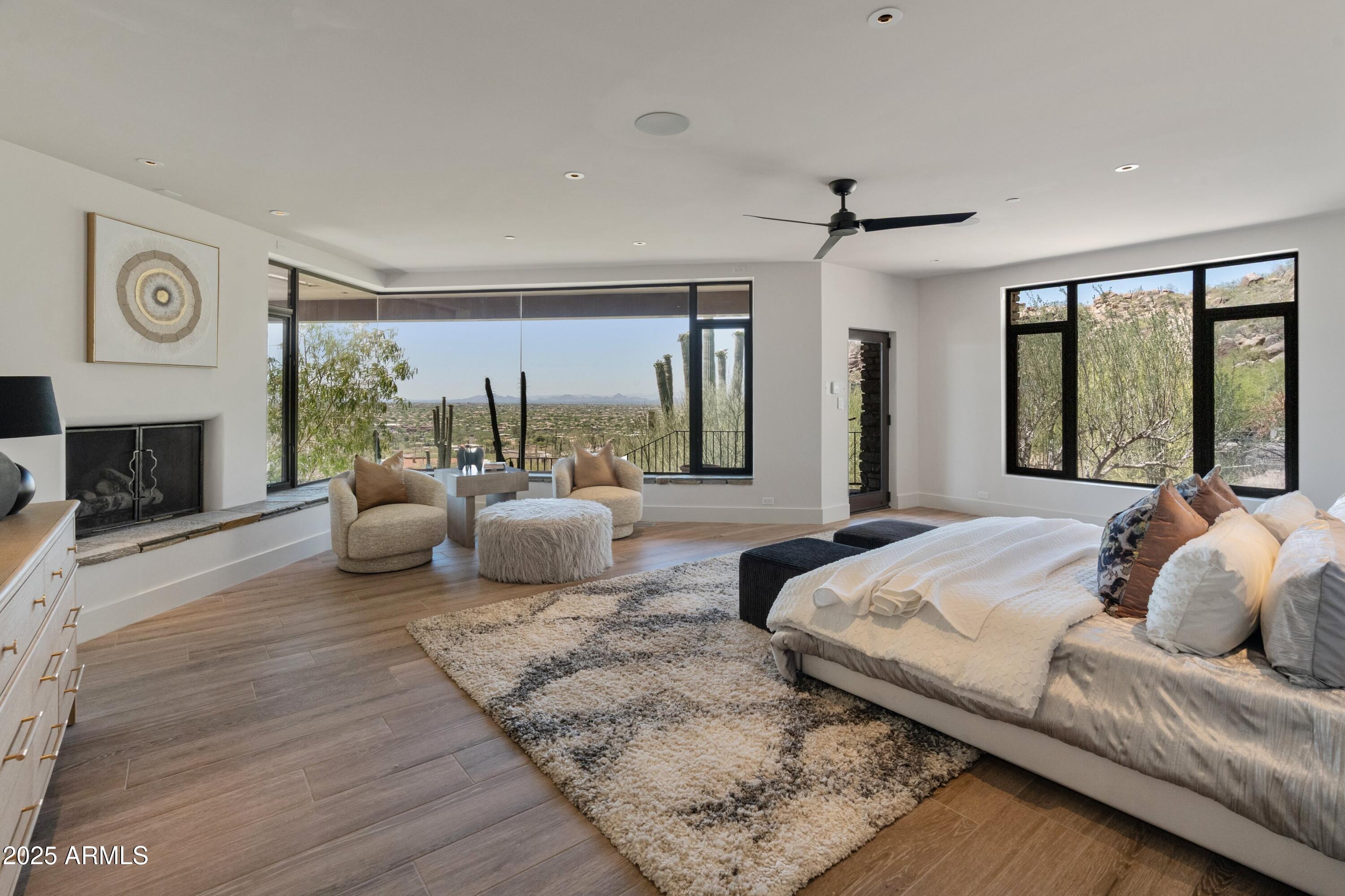 6901 East Restin Road Carefree, AZ 85377 - Photo 25 of 59 a living room with furniture and a fireplace