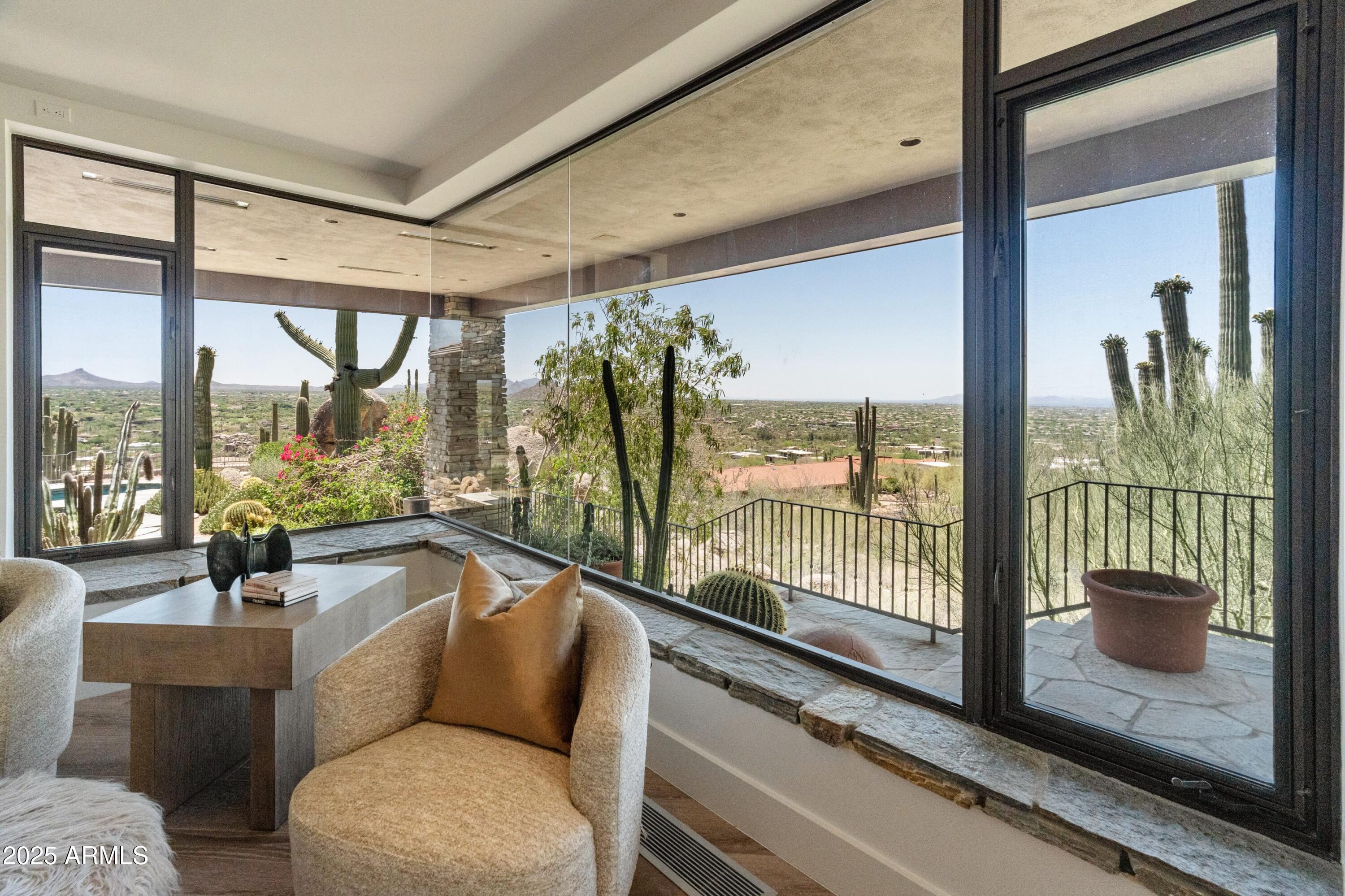 6901 East Restin Road Carefree, AZ 85377 - Photo 28 of 59 a living room with furniture and a floor to ceiling window
