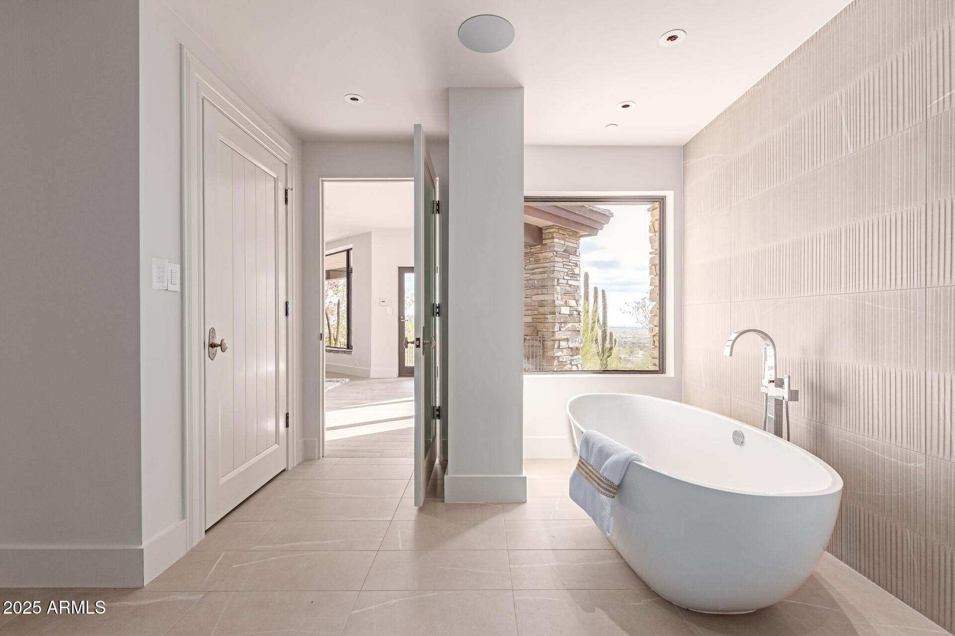6901 East Restin Road Carefree, AZ 85377 - Photo 30 of 59 a bathroom with a bathtub and shower