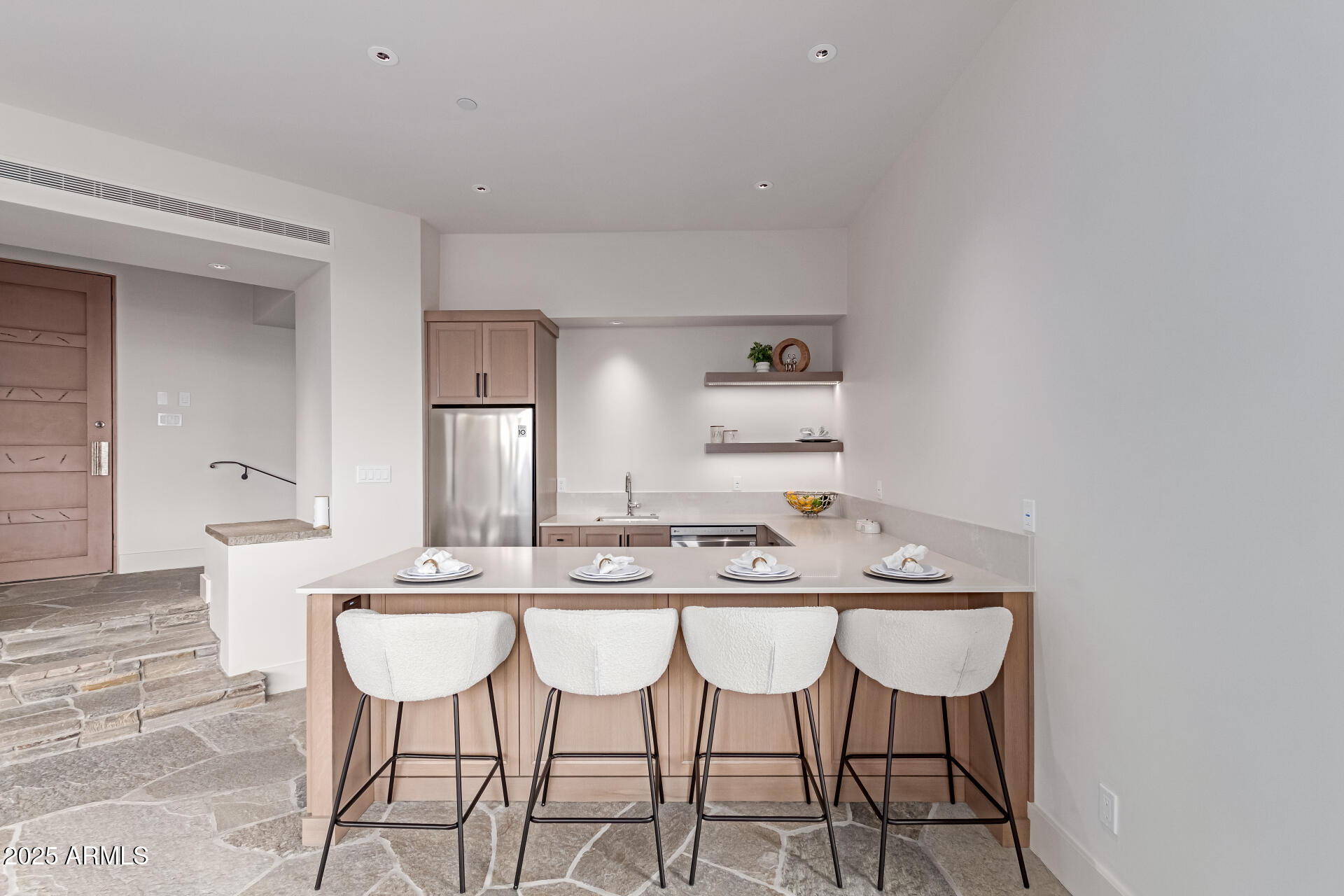 6901 East Restin Road Carefree, AZ 85377 - Photo 36 of 59 a dining room with furniture and wooden floor