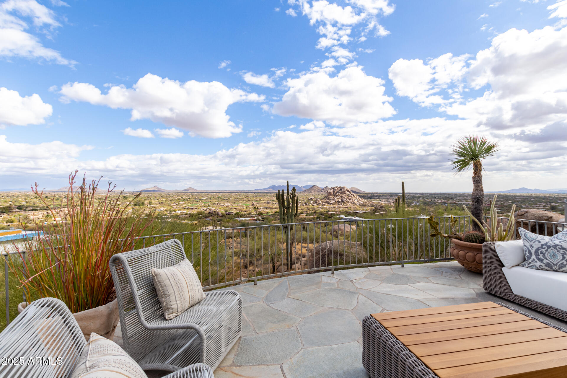6901 East Restin Road Carefree, AZ 85377 - Photo 43 of 59 a view of a terrace with couches and city view