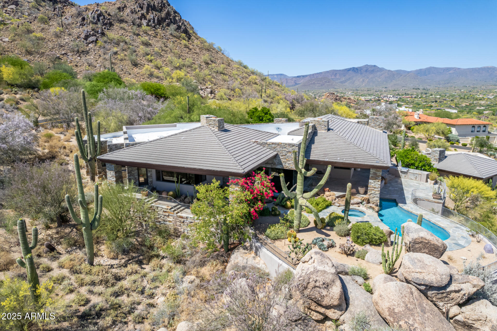 6901 East Restin Road Carefree, AZ 85377 - Photo 7 of 59 a view of a house with a yard and sitting area