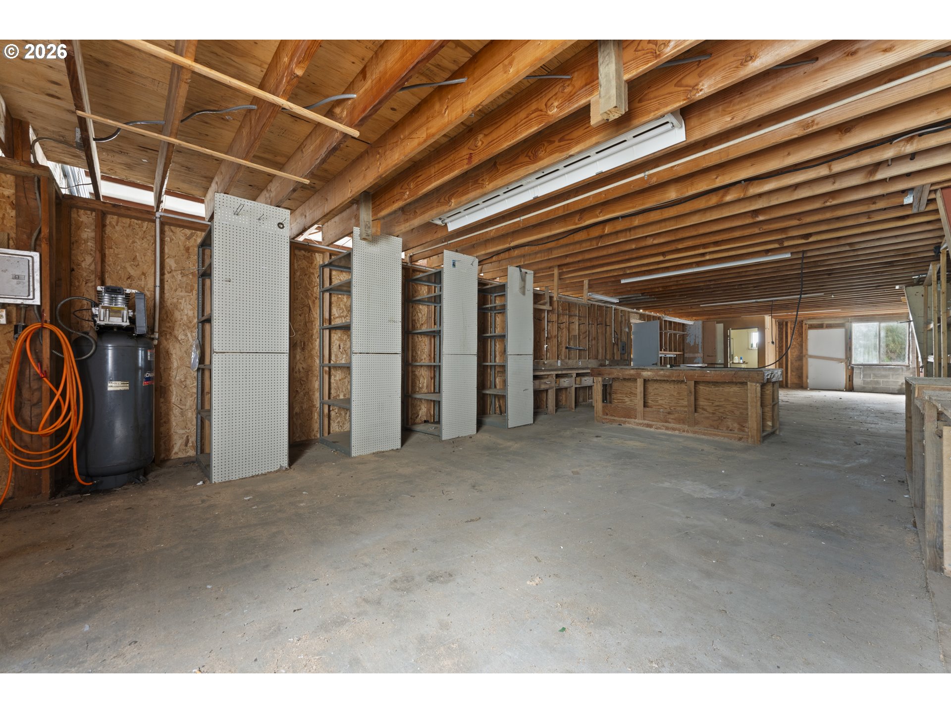 53665 Rosa Road Bandon, OR 97411 - Photo 11 of 47 a view of an empty room with gym equipment