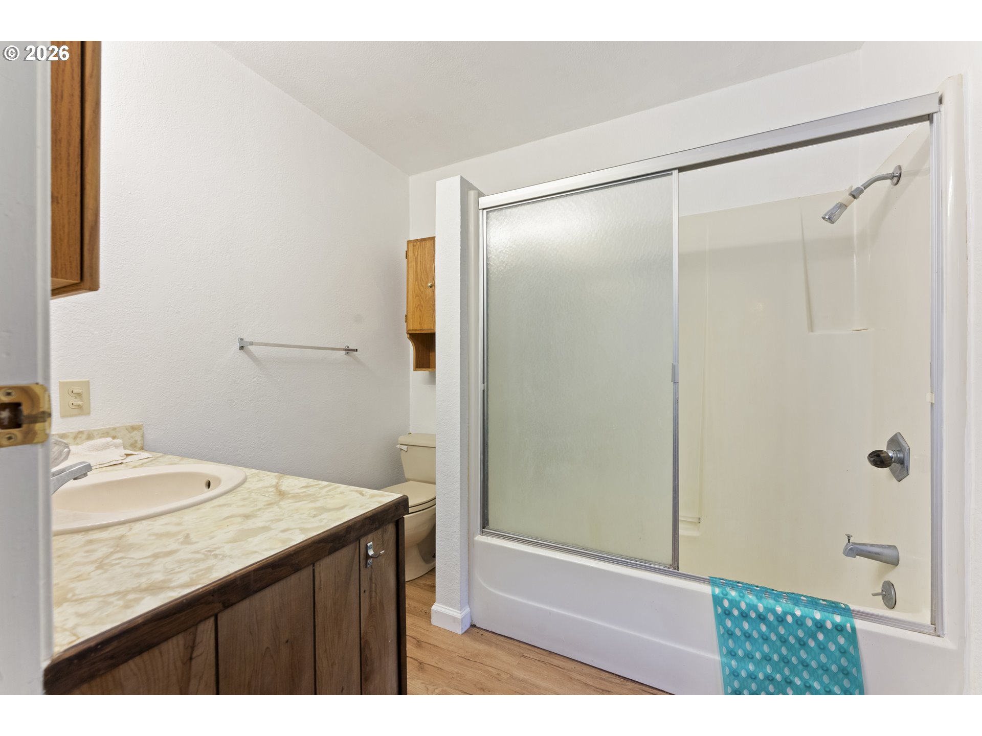 53665 Rosa Road Bandon, OR 97411 - Photo 17 of 47 a bathroom with a granite countertop sink mirror and shower