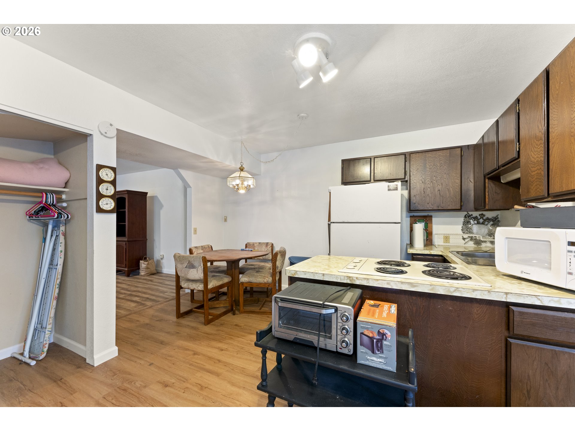 53665 Rosa Road Bandon, OR 97411 - Photo 18 of 47 a kitchen with stainless steel appliances granite countertop a sink refrigerator and cabinets