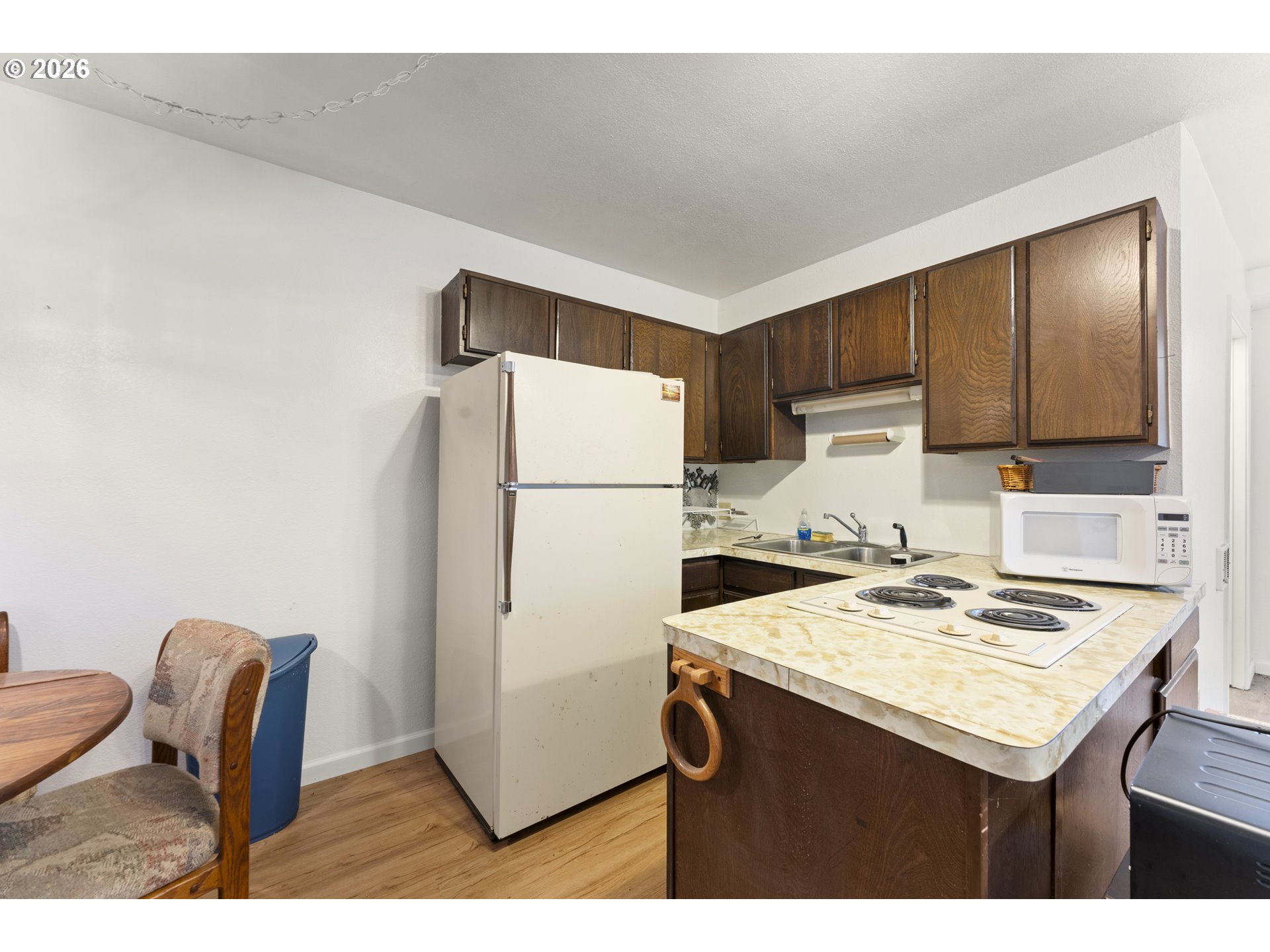 53665 Rosa Road Bandon, OR 97411 - Photo 19 of 47 a kitchen with refrigerator and cabinets