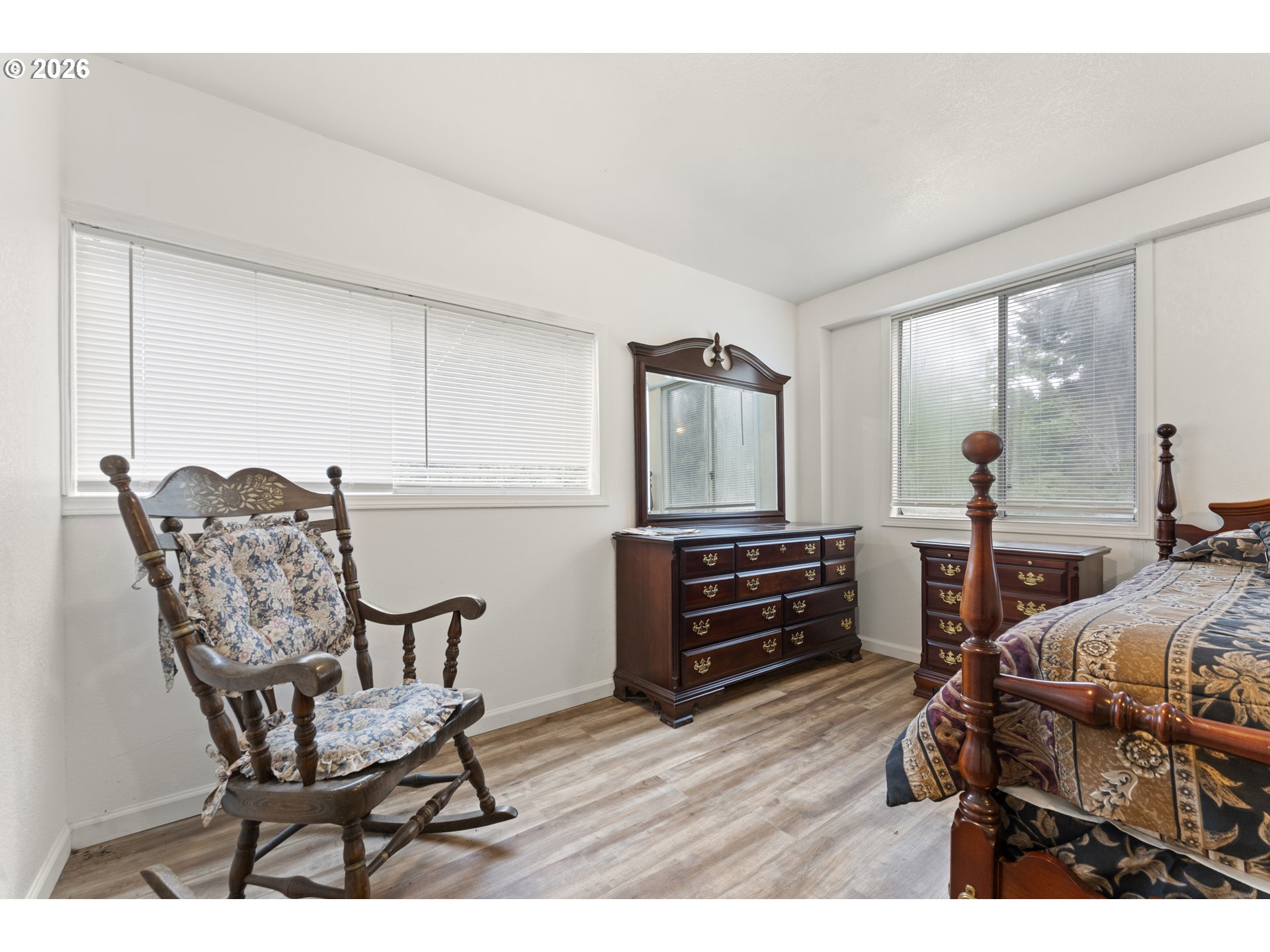 53665 Rosa Road Bandon, OR 97411 - Photo 23 of 47 a bedroom with furniture and a wooden floor