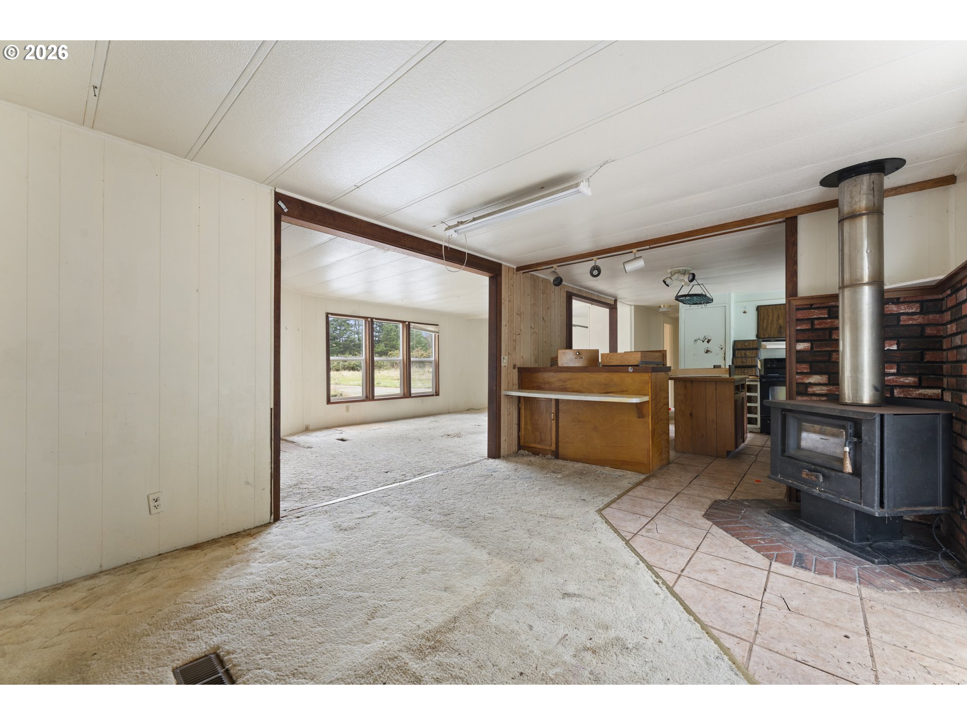 53665 Rosa Road Bandon, OR 97411 - Photo 31 of 47 a view of a livingroom with furniture and kitchen