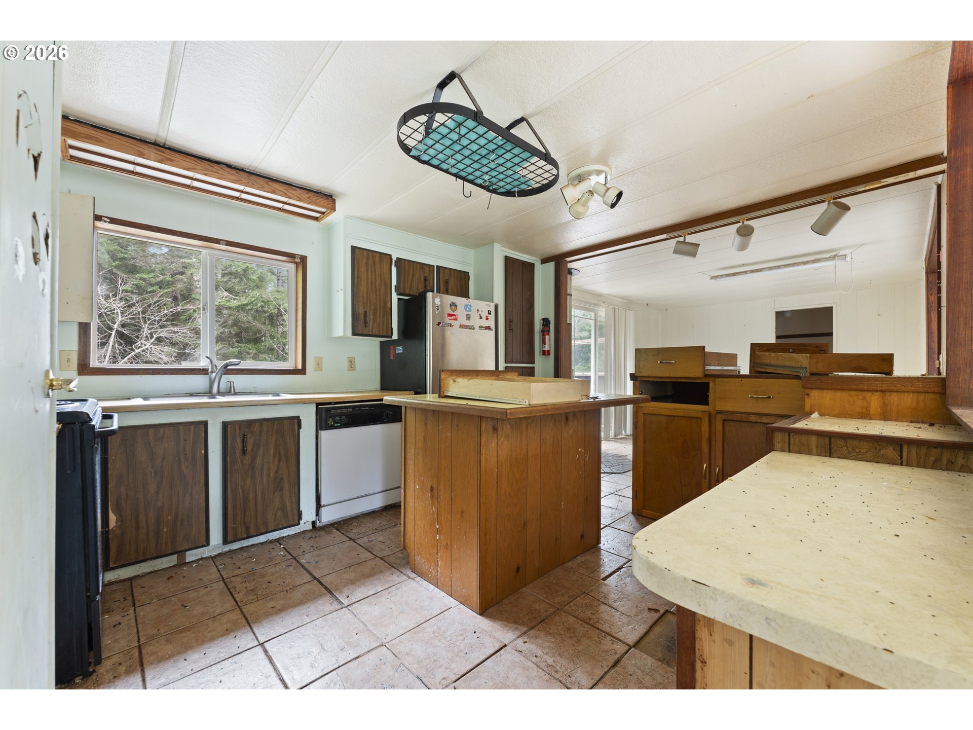 53665 Rosa Road Bandon, OR 97411 - Photo 34 of 47 a kitchen with stainless steel appliances kitchen island granite countertop a stove and a sink