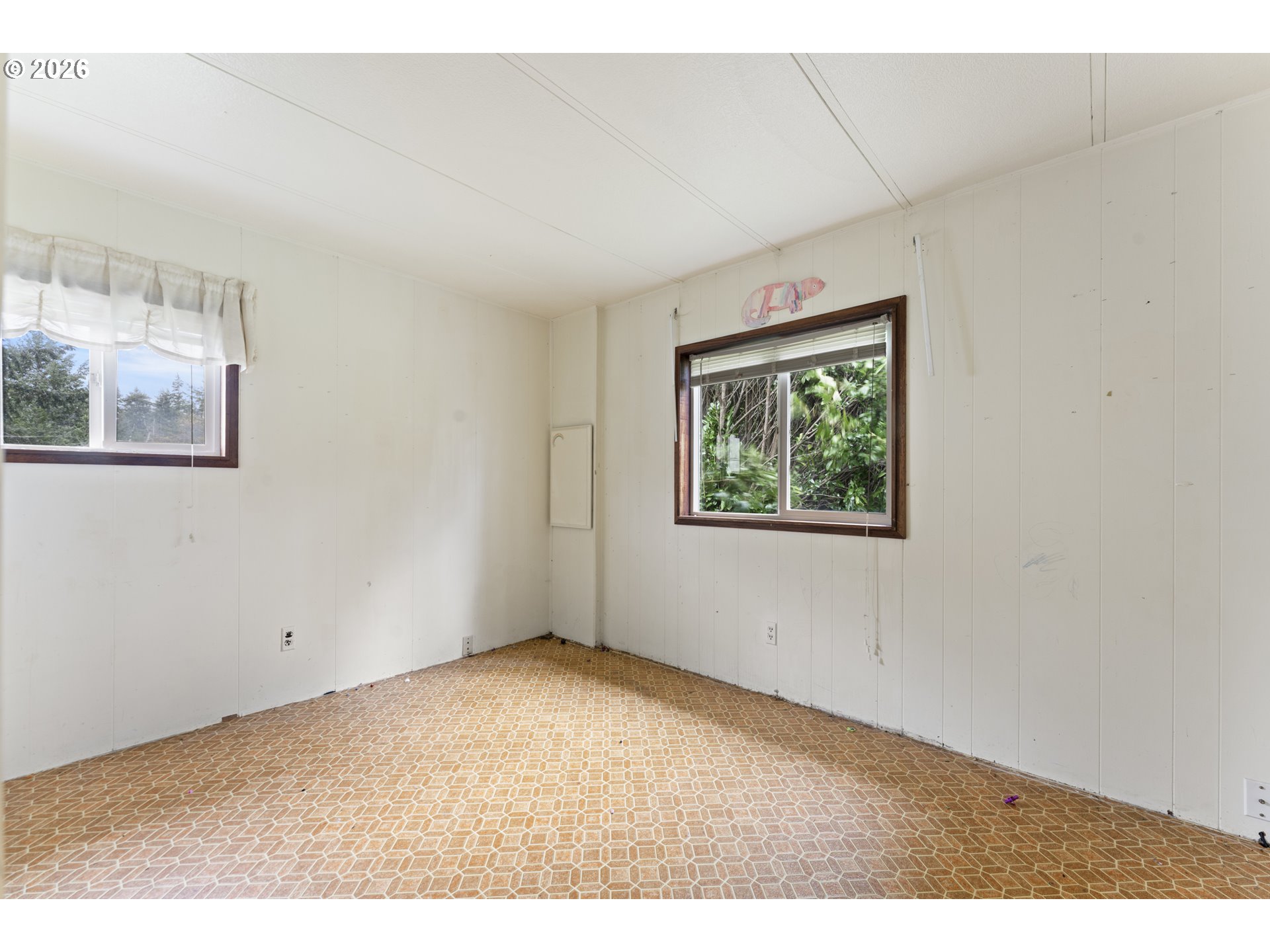 53665 Rosa Road Bandon, OR 97411 - Photo 37 of 47 a view of an empty room with a window