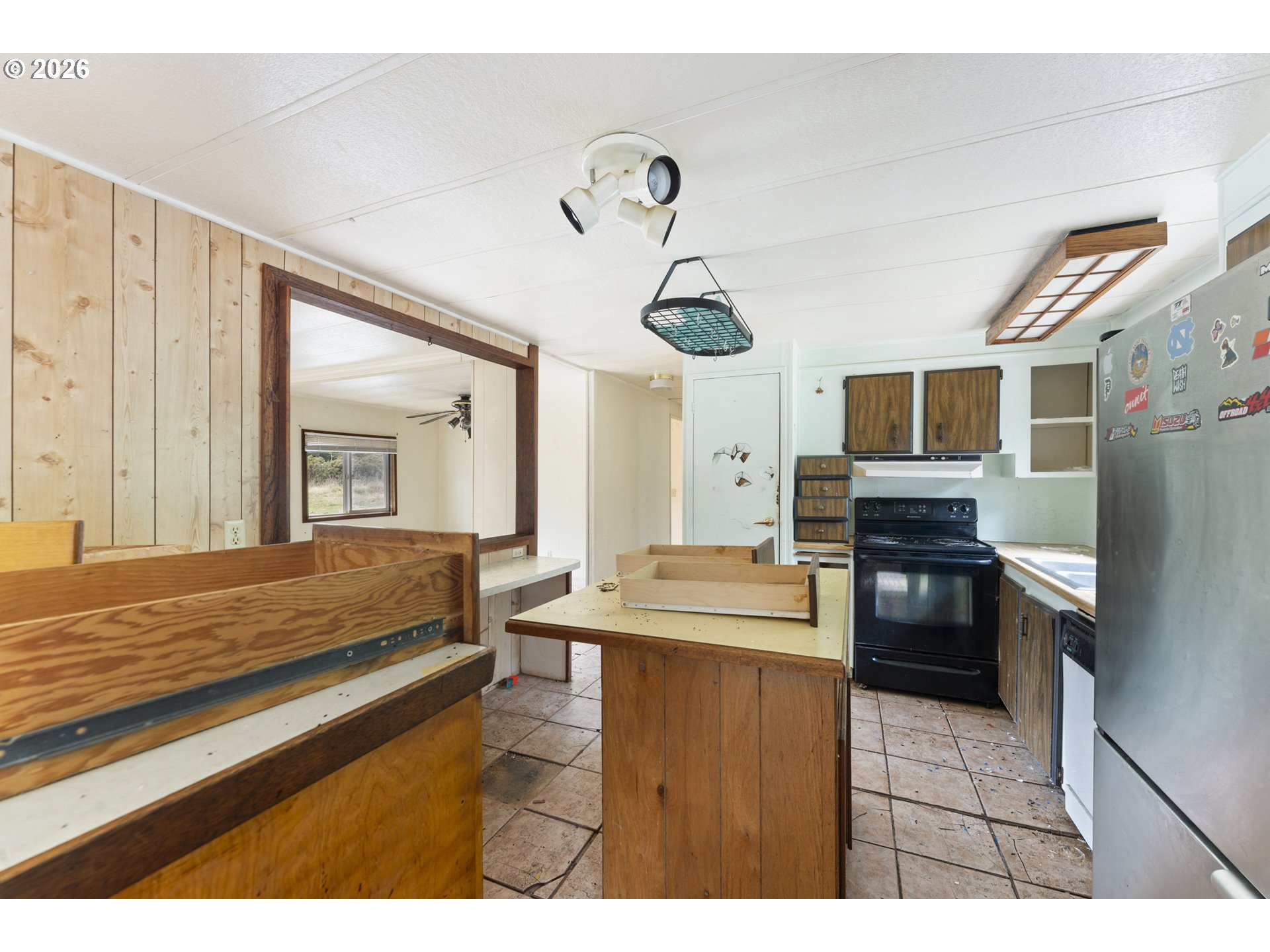 53665 Rosa Road Bandon, OR 97411 - Photo 43 of 47 a kitchen with a refrigerator and a sink