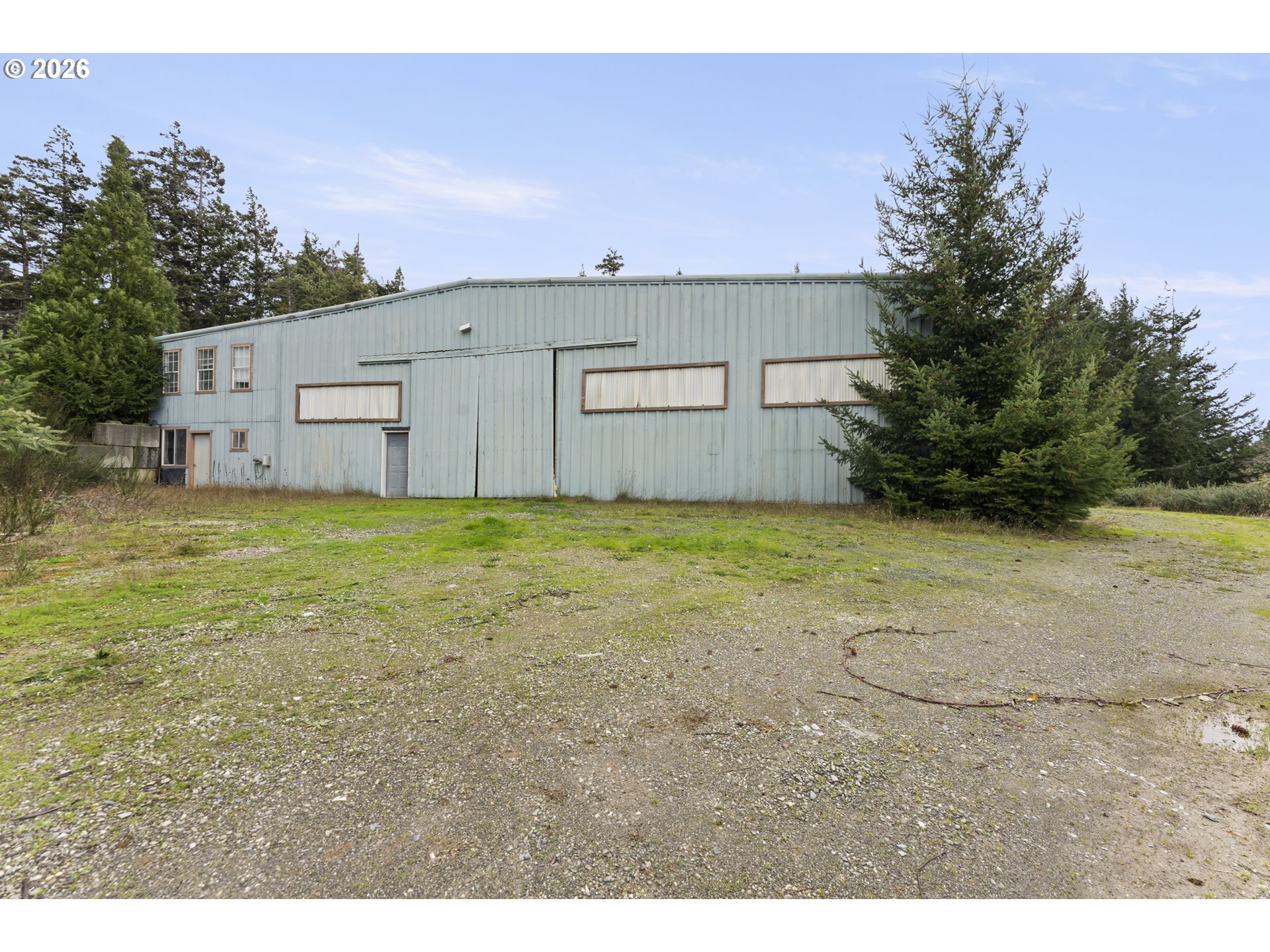 53665 Rosa Road Bandon, OR 97411 - Photo 7 of 47 a view of a outdoor space with a house