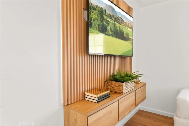 a room with a potted plant and a window