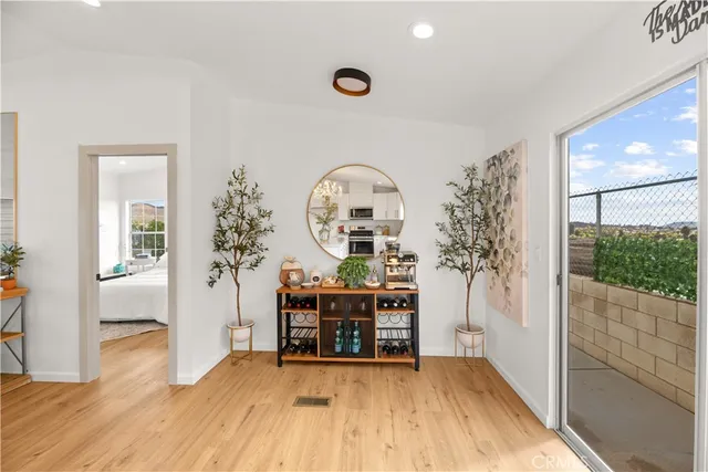 a view of a livingroom with furniture and wooden floor